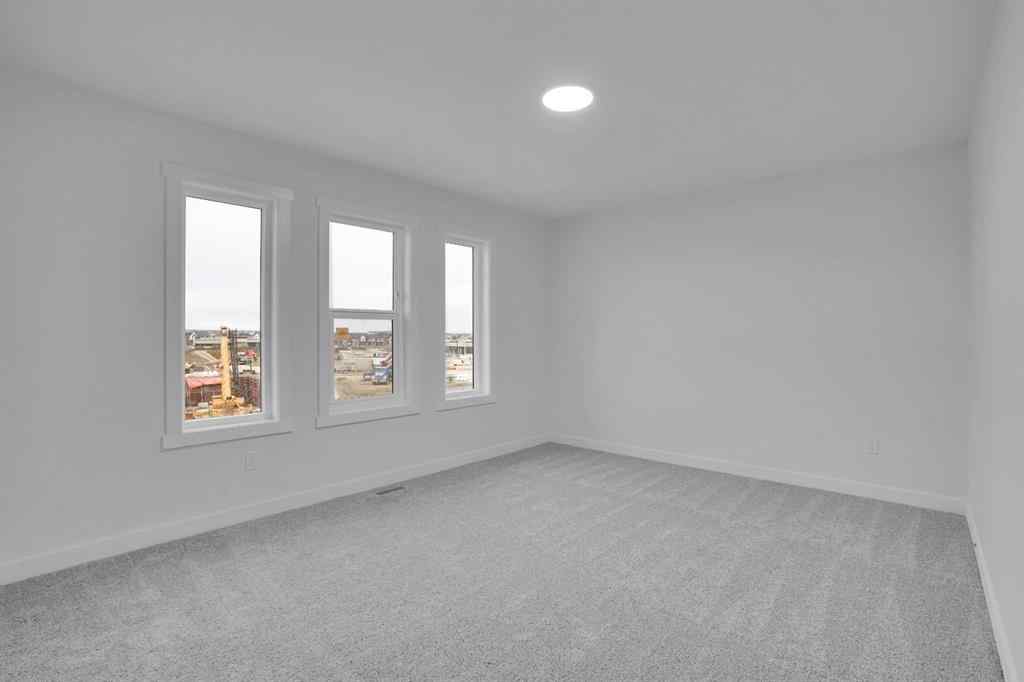 MLS® A2269005 - 186 Belmont Street SW in Belmont Calgary, Residential