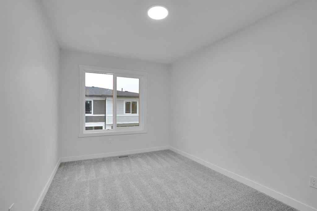 MLS® A2269005 - 186 Belmont Street SW in Belmont Calgary, Residential