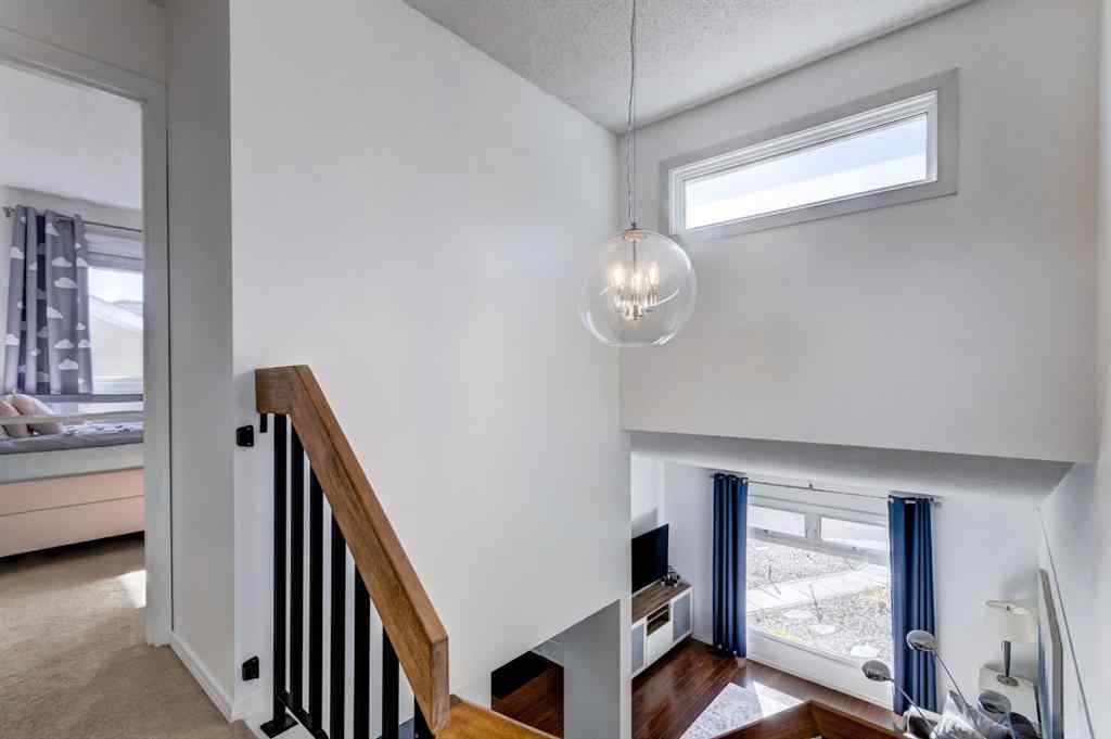 MLS® A2269029 - 235 Strathearn Crescent SW in Strathcona Park Calgary, Residential