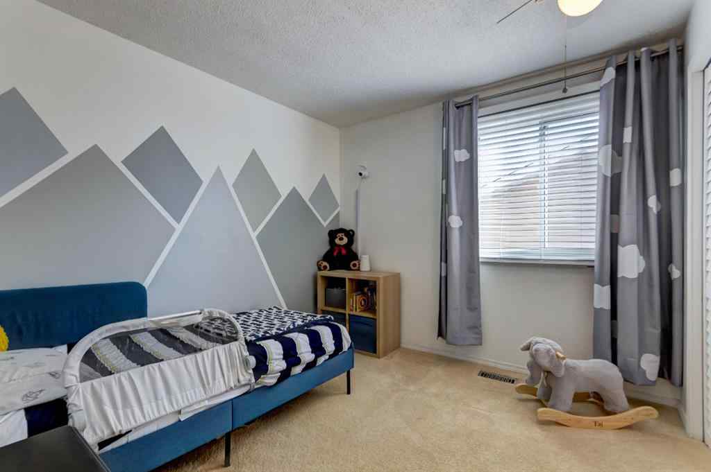 MLS® A2269029 - 235 Strathearn Crescent SW in Strathcona Park Calgary, Residential