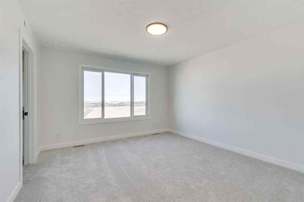 MLS® A2269062 - 306 Hotchkiss Manor SE in Hotchkiss Calgary, Residential