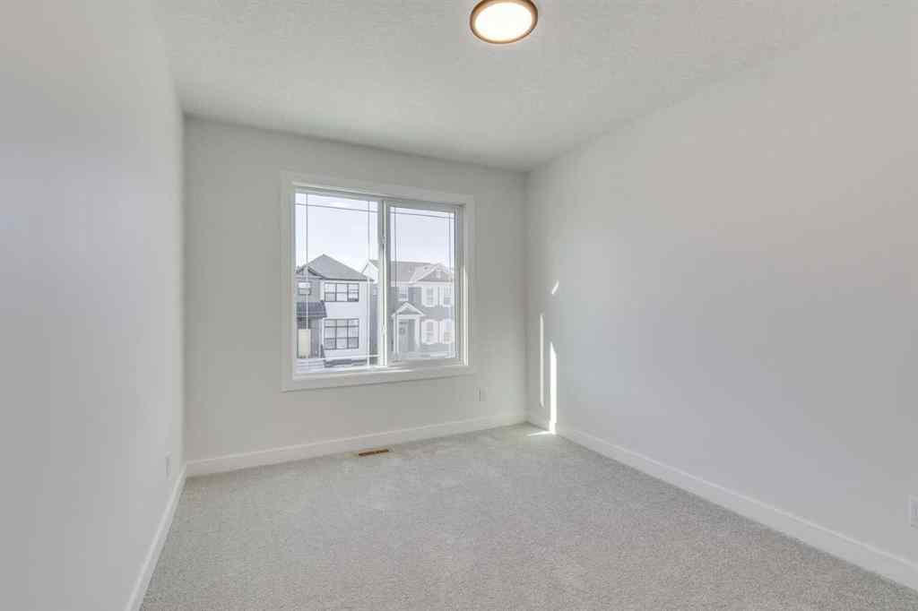 MLS® A2269062 - 306 Hotchkiss Manor SE in Hotchkiss Calgary, Residential