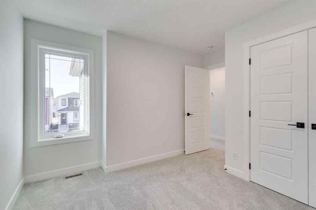 MLS® A2269062 - 306 Hotchkiss Manor SE in Hotchkiss Calgary, Residential