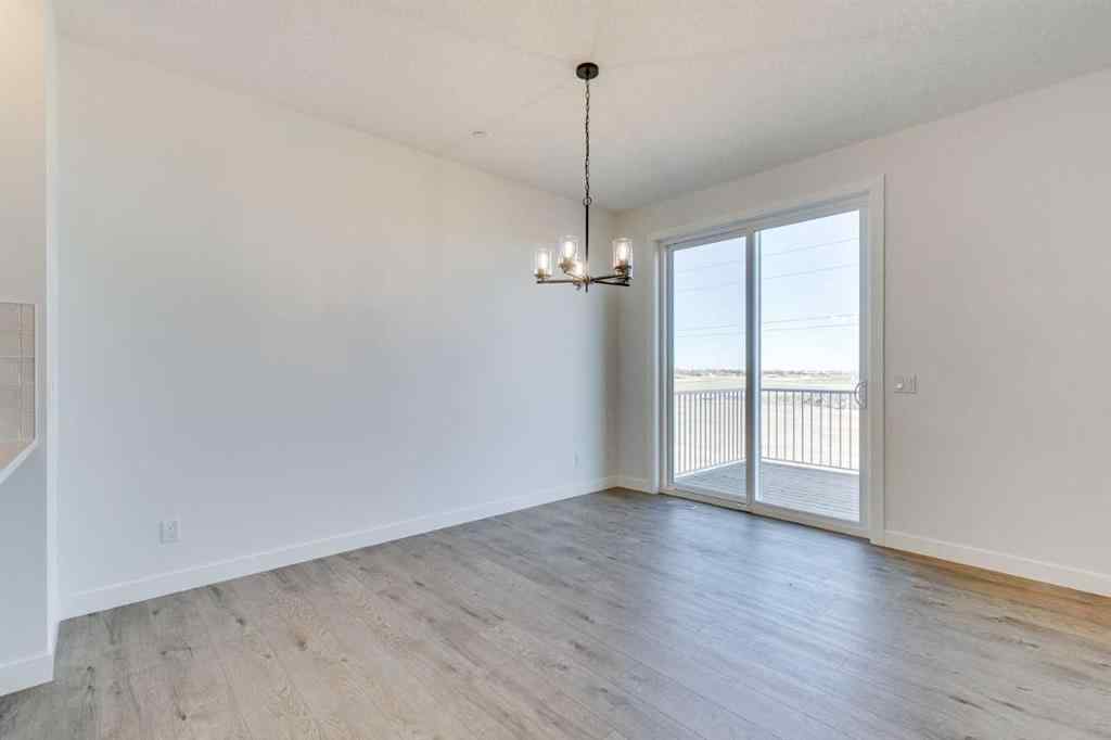 MLS® A2269062 - 306 Hotchkiss Manor SE in Hotchkiss Calgary, Residential