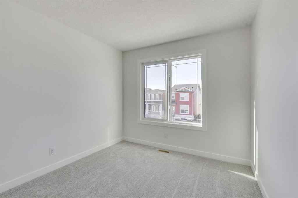 MLS® A2269062 - 306 Hotchkiss Manor SE in Hotchkiss Calgary, Residential