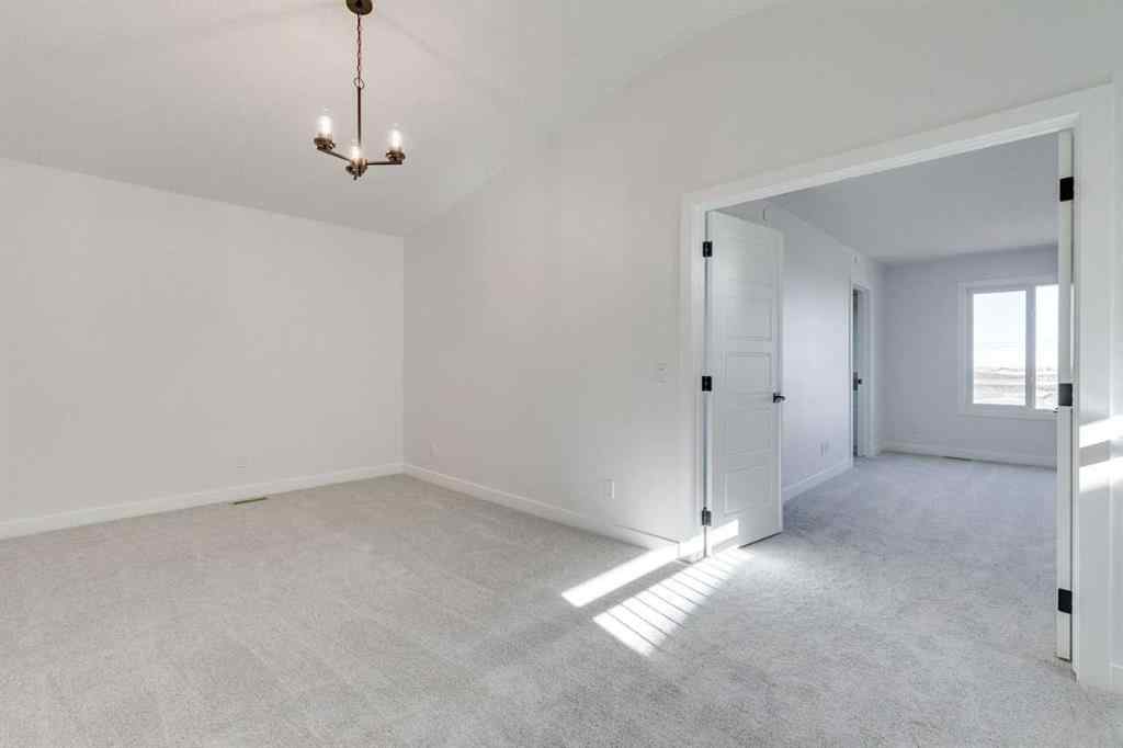 MLS® A2269062 - 306 Hotchkiss Manor SE in Hotchkiss Calgary, Residential