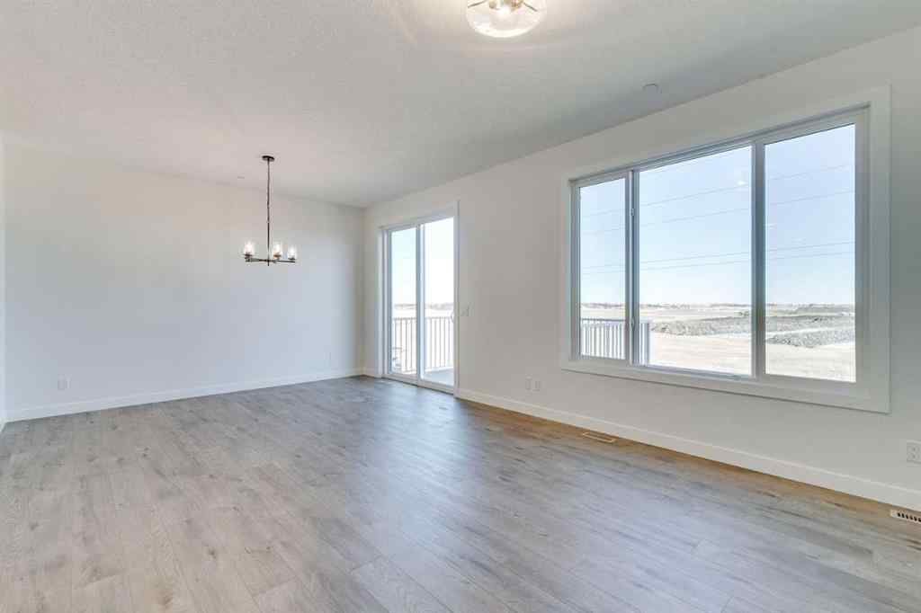 MLS® A2269062 - 306 Hotchkiss Manor SE in Hotchkiss Calgary, Residential