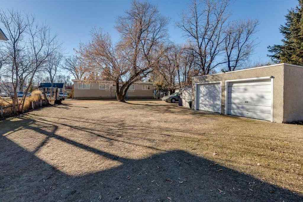 MLS® A2269138 - 5218 56 Avenue  in Central Ponoka Ponoka, Multi-Family