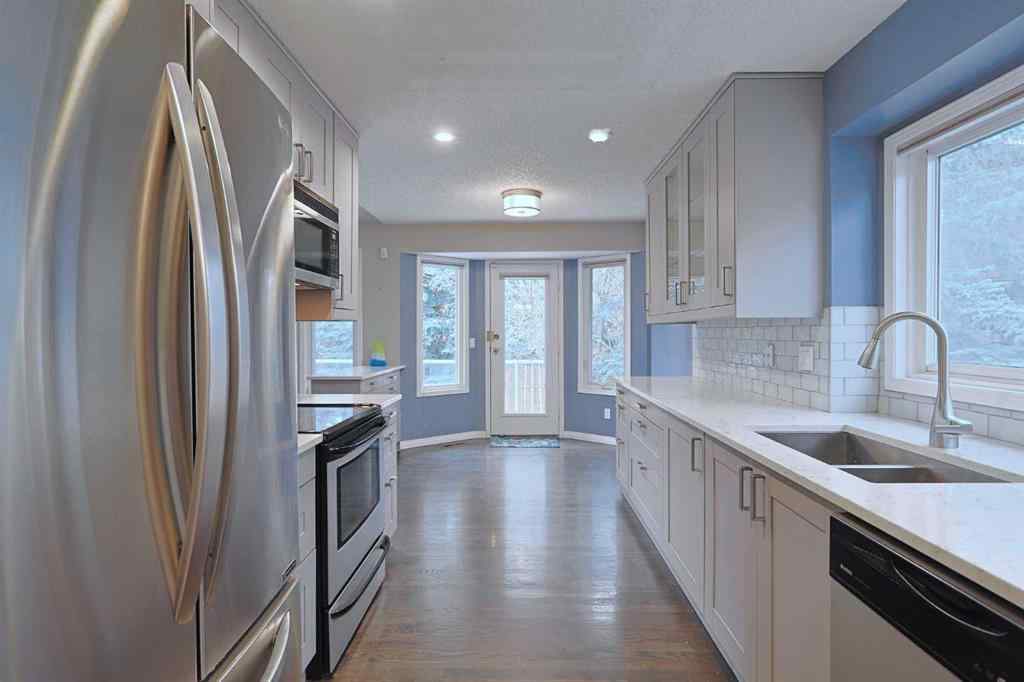 MLS&reg; # A2269283 - 220 Silver Creek Mews NW in Silver Springs Calgary, Residential Open Houses