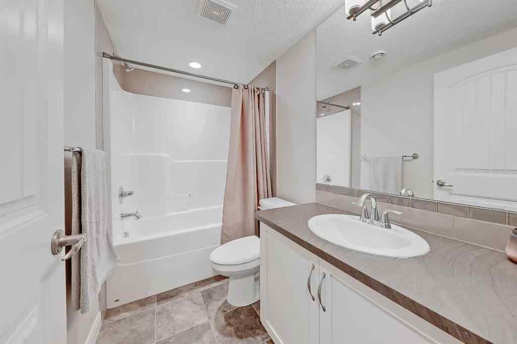 MLS&reg; # A2269307 - 63 Ravenscroft Close SE in Ravenswood Airdrie, Residential Open Houses