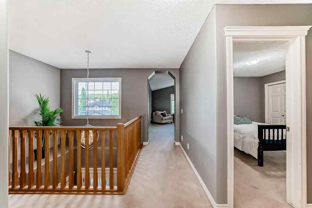MLS® A2269405 - 73 Crestmont Drive SW in Crestmont Calgary, Residential