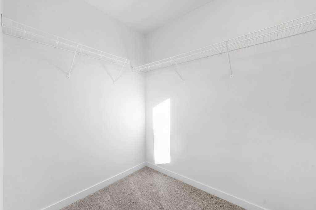 MLS® A2269440 - 64 Creekside Boulevard SW in Pine Creek Calgary, Residential