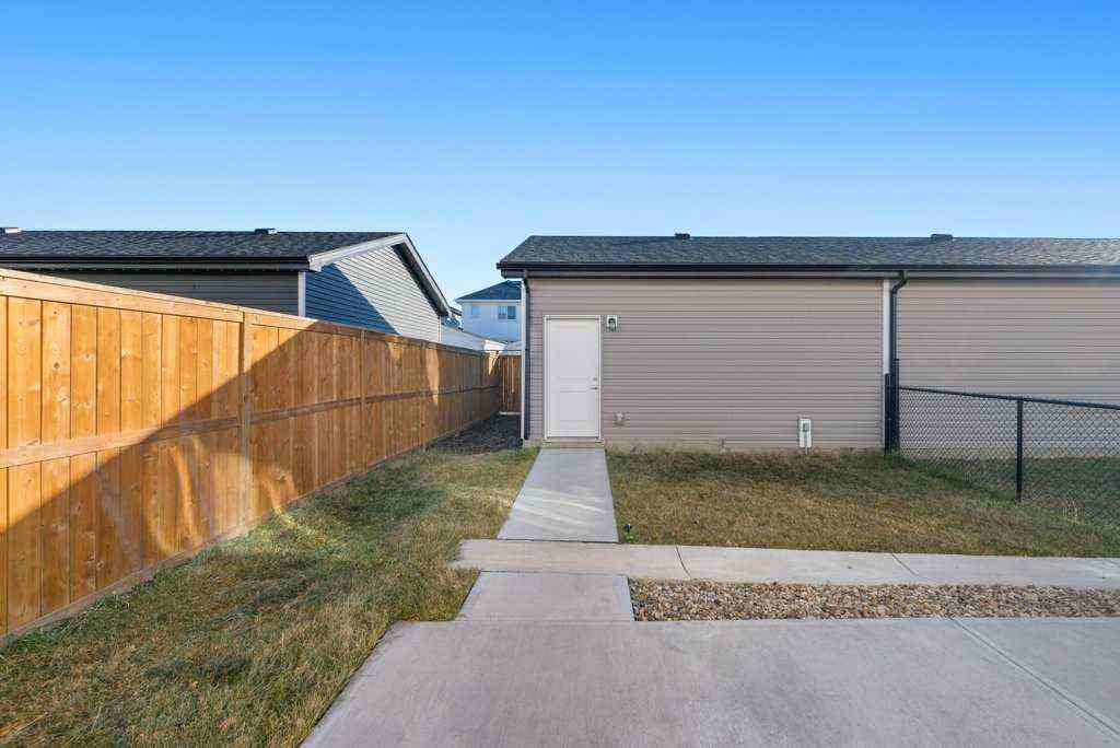 MLS® A2269440 - 64 Creekside Boulevard SW in Pine Creek Calgary, Residential