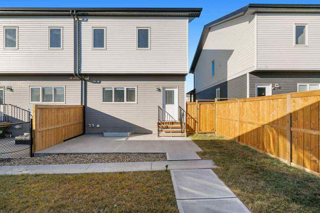 MLS® A2269440 - 64 Creekside Boulevard SW in Pine Creek Calgary, Residential