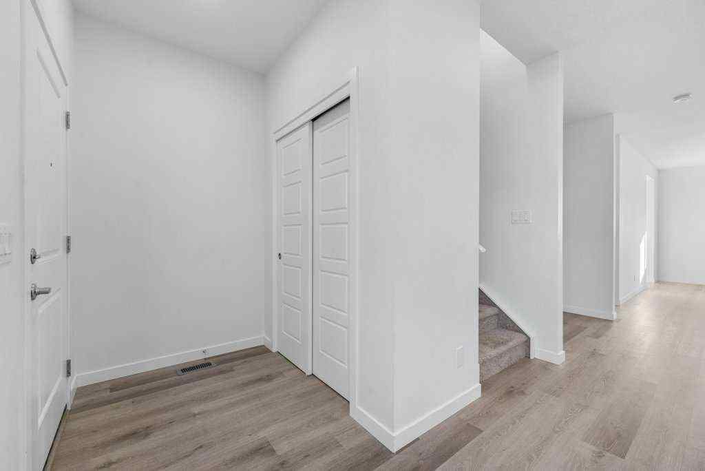 MLS® A2269440 - 64 Creekside Boulevard SW in Pine Creek Calgary, Residential