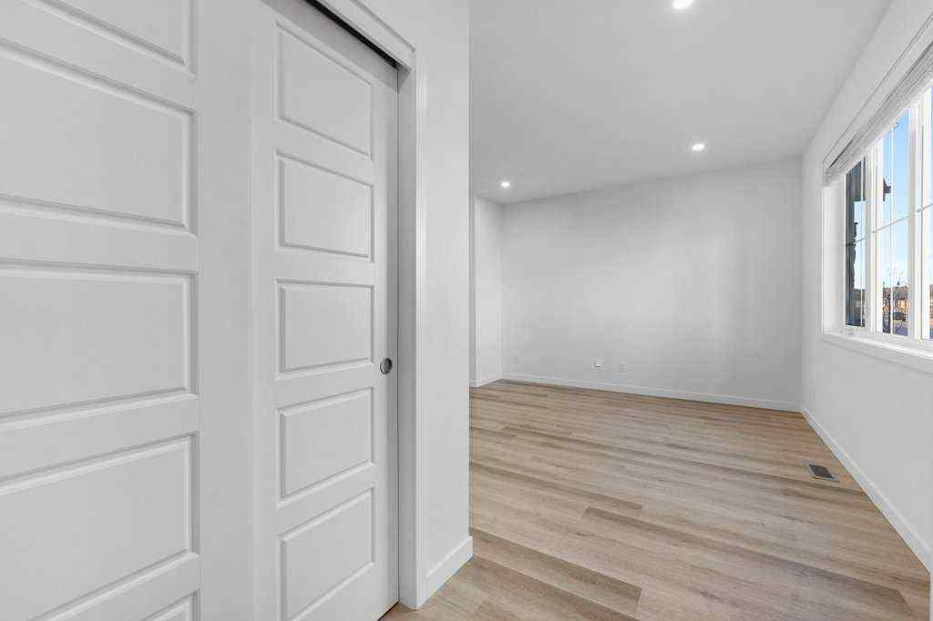 MLS® A2269440 - 64 Creekside Boulevard SW in Pine Creek Calgary, Residential