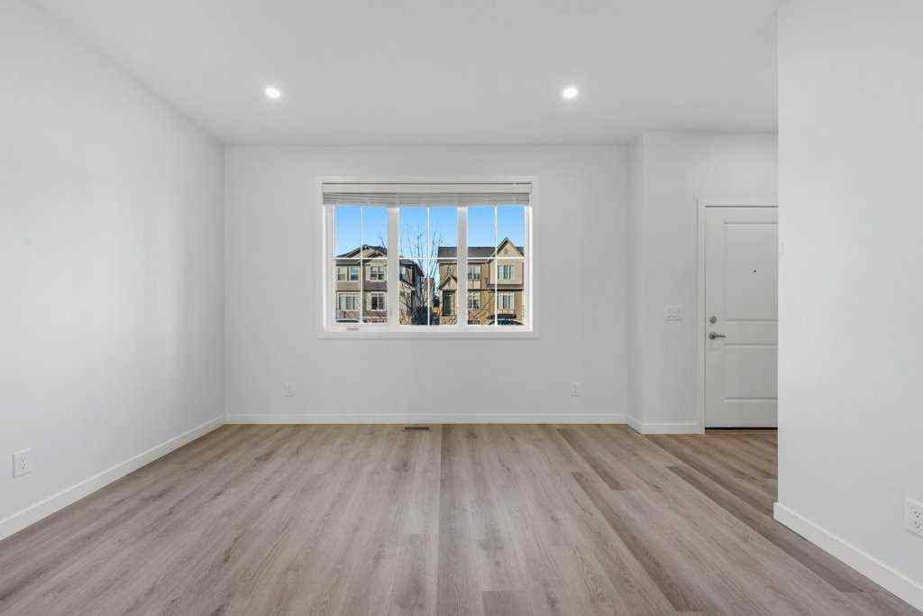 MLS® A2269440 - 64 Creekside Boulevard SW in Pine Creek Calgary, Residential