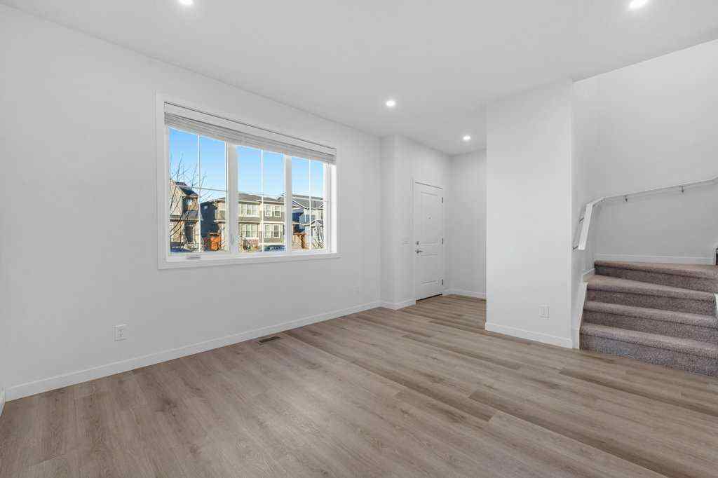 MLS® A2269440 - 64 Creekside Boulevard SW in Pine Creek Calgary, Residential