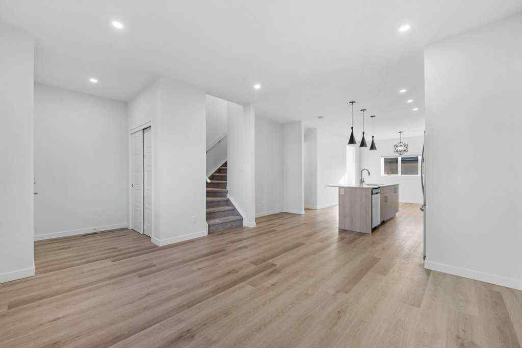 MLS® A2269440 - 64 Creekside Boulevard SW in Pine Creek Calgary, Residential