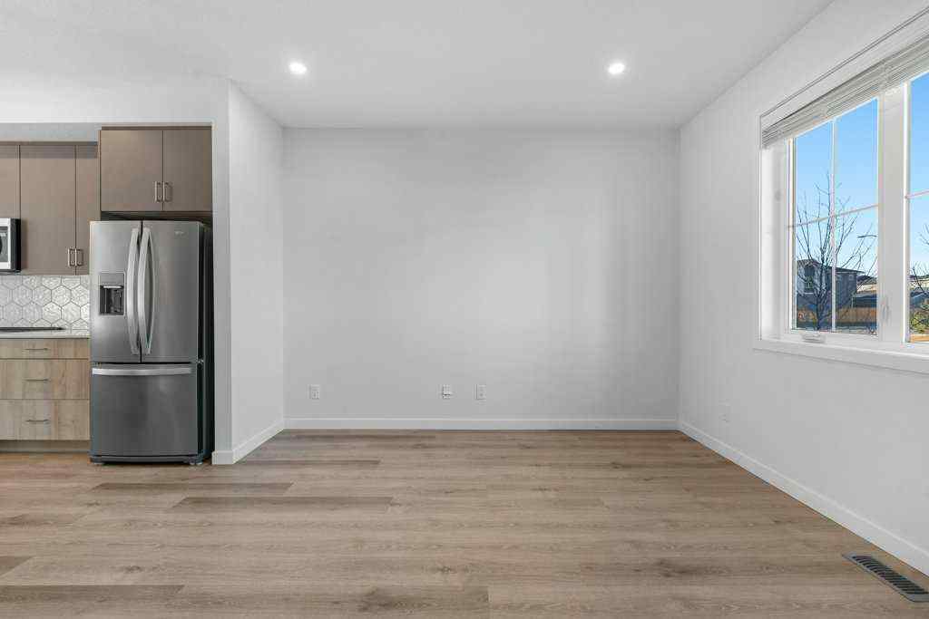 MLS® A2269440 - 64 Creekside Boulevard SW in Pine Creek Calgary, Residential