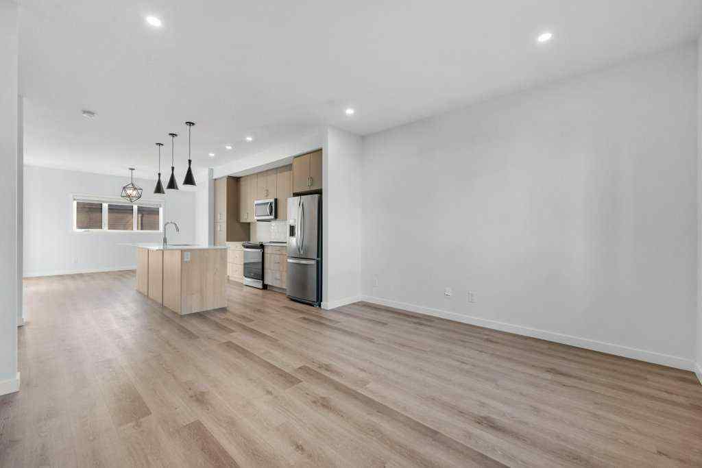 MLS® A2269440 - 64 Creekside Boulevard SW in Pine Creek Calgary, Residential