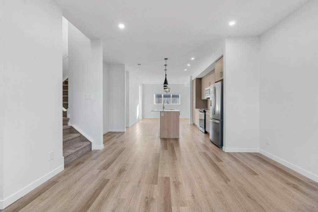 MLS® A2269440 - 64 Creekside Boulevard SW in Pine Creek Calgary, Residential