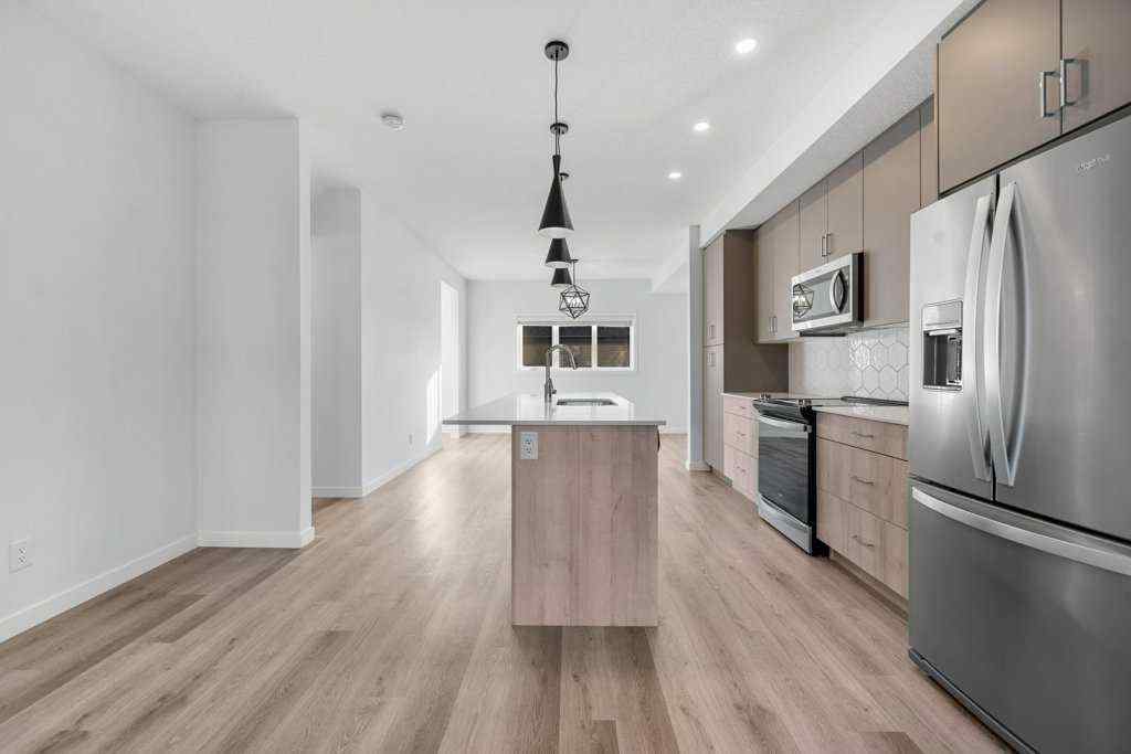 MLS® A2269440 - 64 Creekside Boulevard SW in Pine Creek Calgary, Residential