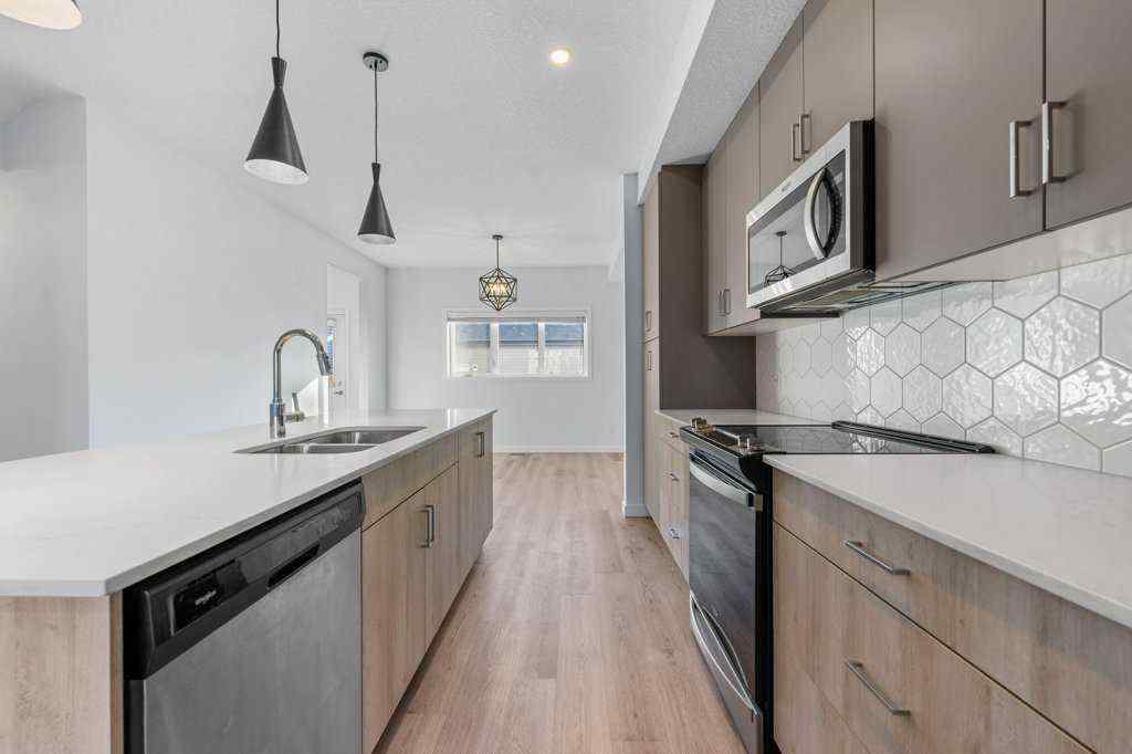 MLS® A2269440 - 64 Creekside Boulevard SW in Pine Creek Calgary, Residential