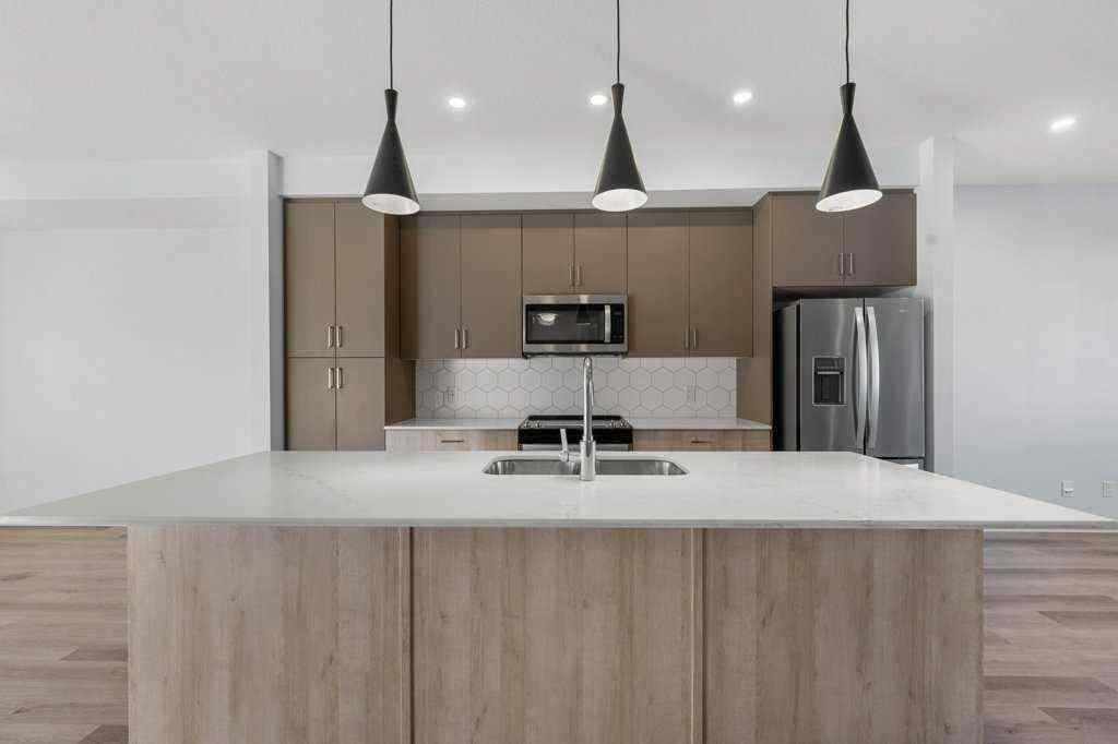 MLS® A2269440 - 64 Creekside Boulevard SW in Pine Creek Calgary, Residential