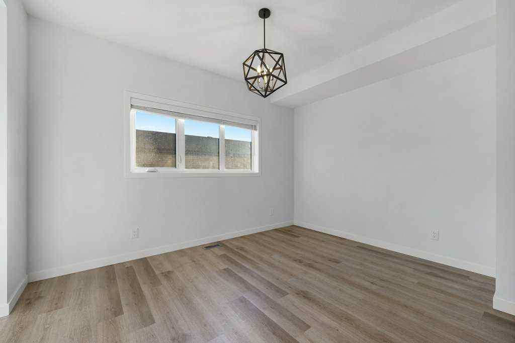 MLS® A2269440 - 64 Creekside Boulevard SW in Pine Creek Calgary, Residential