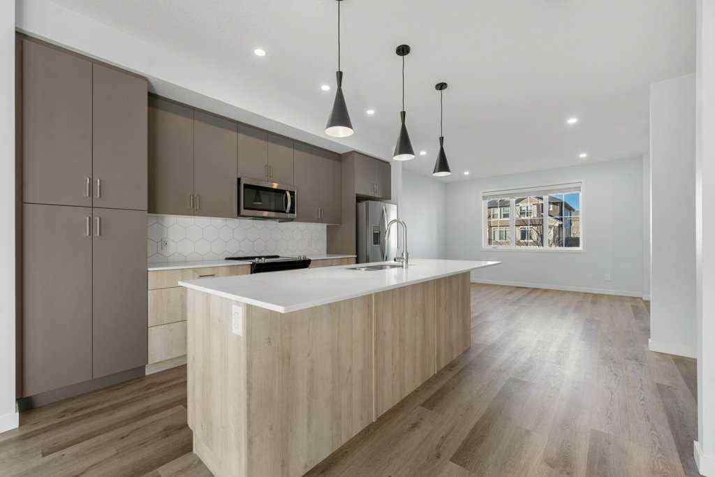 MLS® A2269440 - 64 Creekside Boulevard SW in Pine Creek Calgary, Residential