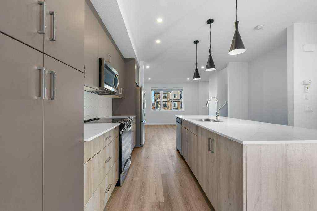 MLS® A2269440 - 64 Creekside Boulevard SW in Pine Creek Calgary, Residential