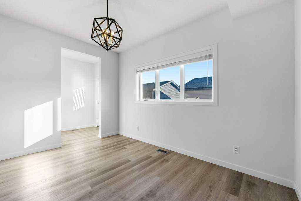 MLS® A2269440 - 64 Creekside Boulevard SW in Pine Creek Calgary, Residential