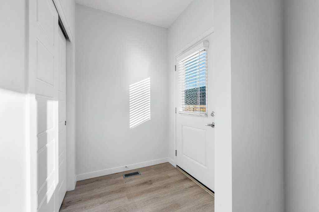 MLS® A2269440 - 64 Creekside Boulevard SW in Pine Creek Calgary, Residential