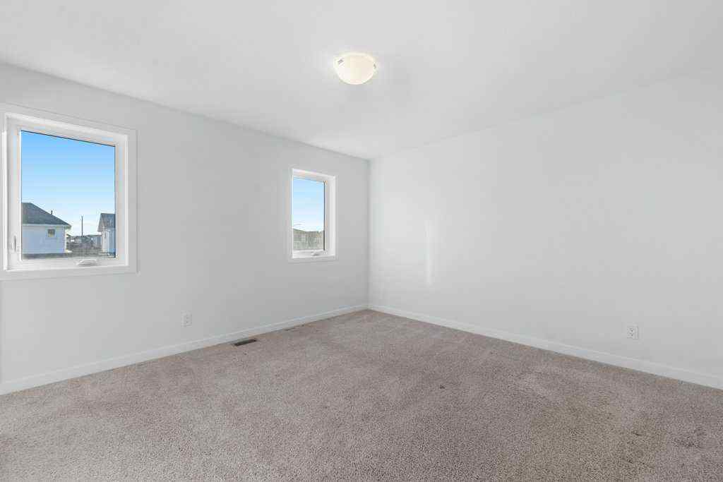 MLS® A2269440 - 64 Creekside Boulevard SW in Pine Creek Calgary, Residential