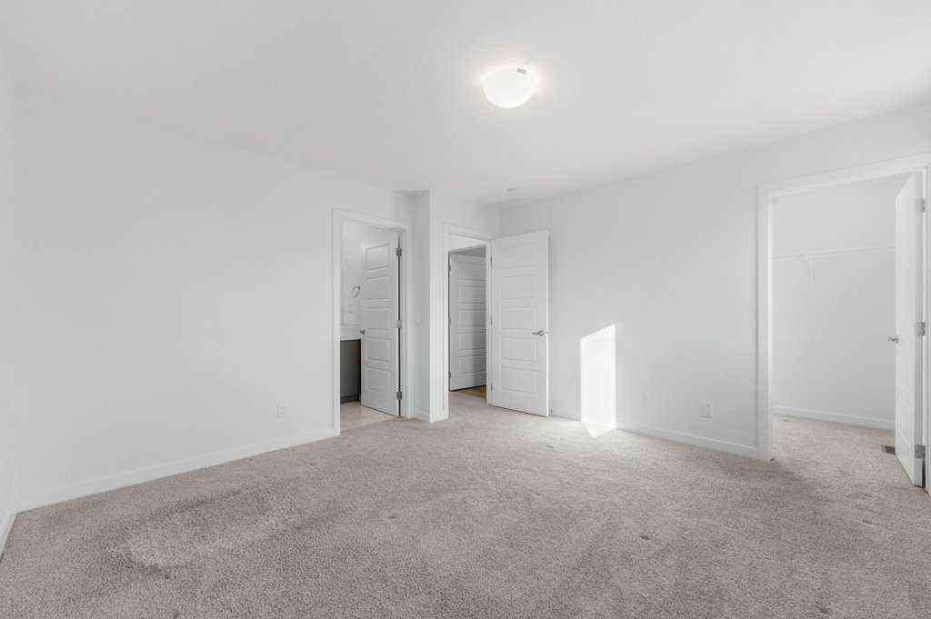 MLS® A2269440 - 64 Creekside Boulevard SW in Pine Creek Calgary, Residential