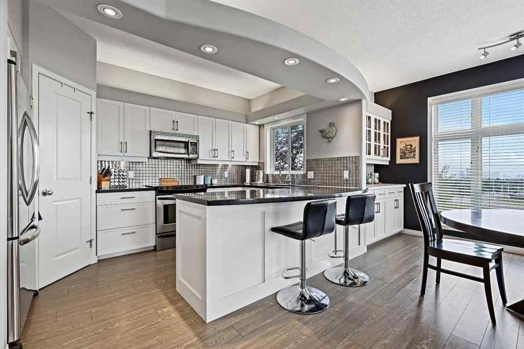 MLS&reg; # A2269893 - Unit #1 5616 14 Avenue SW in Christie Park Calgary, Residential Open Houses