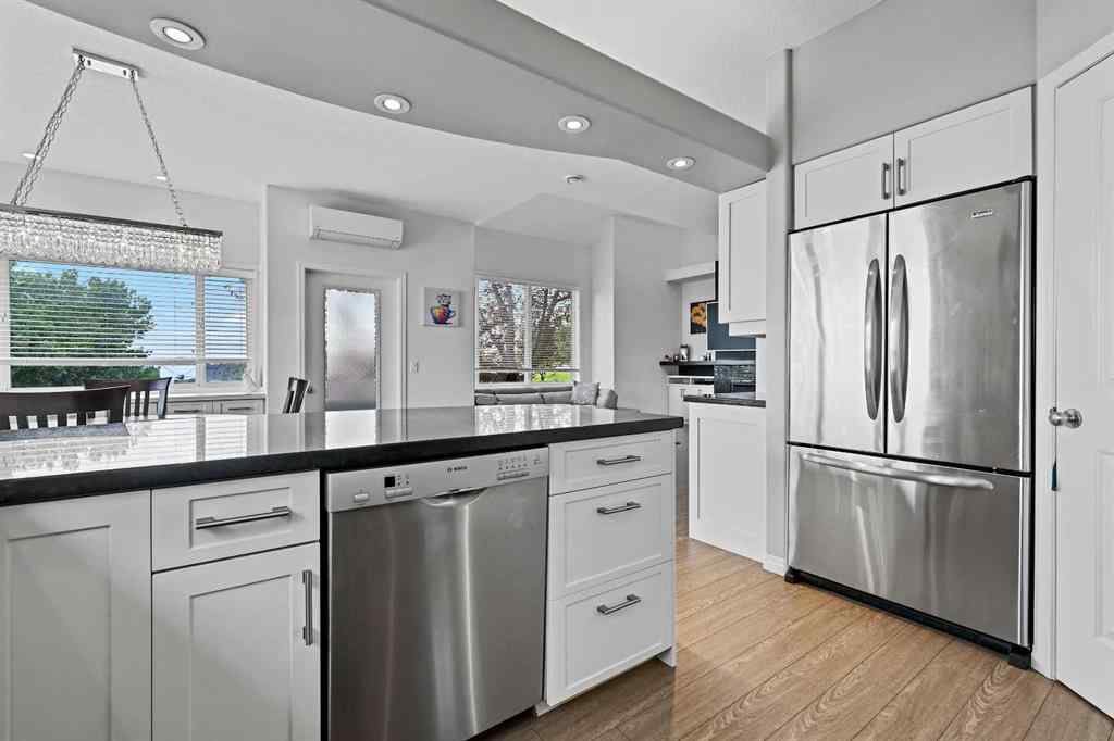 MLS&reg; # A2269893 - Unit #1 5616 14 Avenue SW in Christie Park Calgary, Residential Open Houses