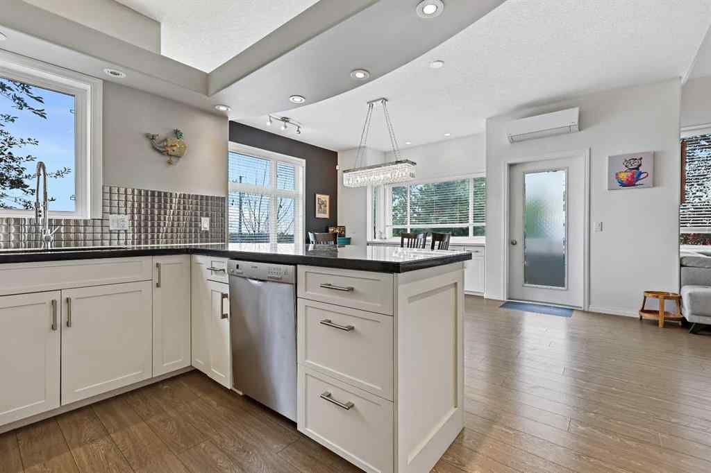 MLS&reg; # A2269893 - Unit #1 5616 14 Avenue SW in Christie Park Calgary, Residential Open Houses