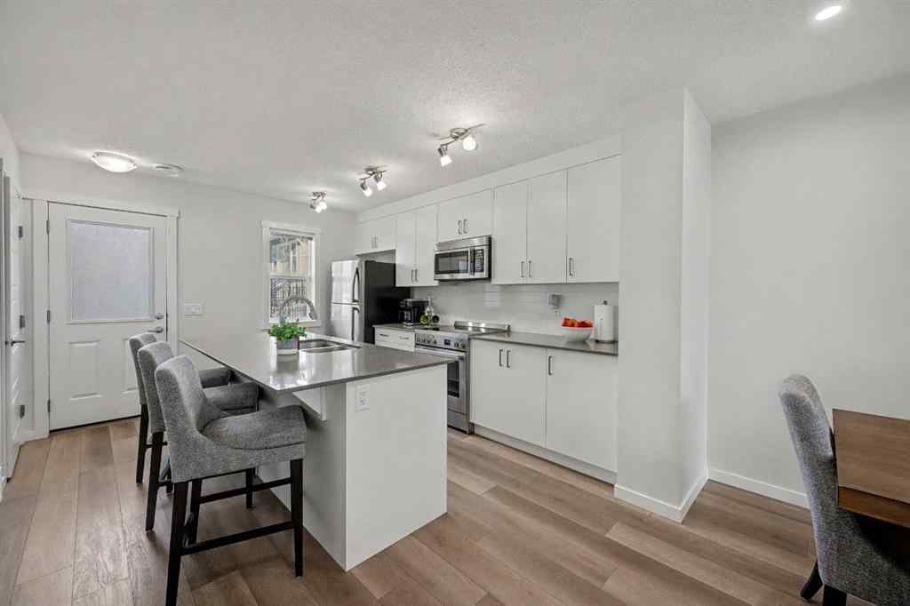 MLS&reg; # A2270542 - 352 Cranbrook Square SE in Cranston Calgary, Residential Open Houses
