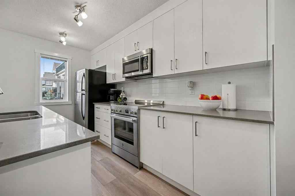 MLS&reg; # A2270542 - 352 Cranbrook Square SE in Cranston Calgary, Residential Open Houses