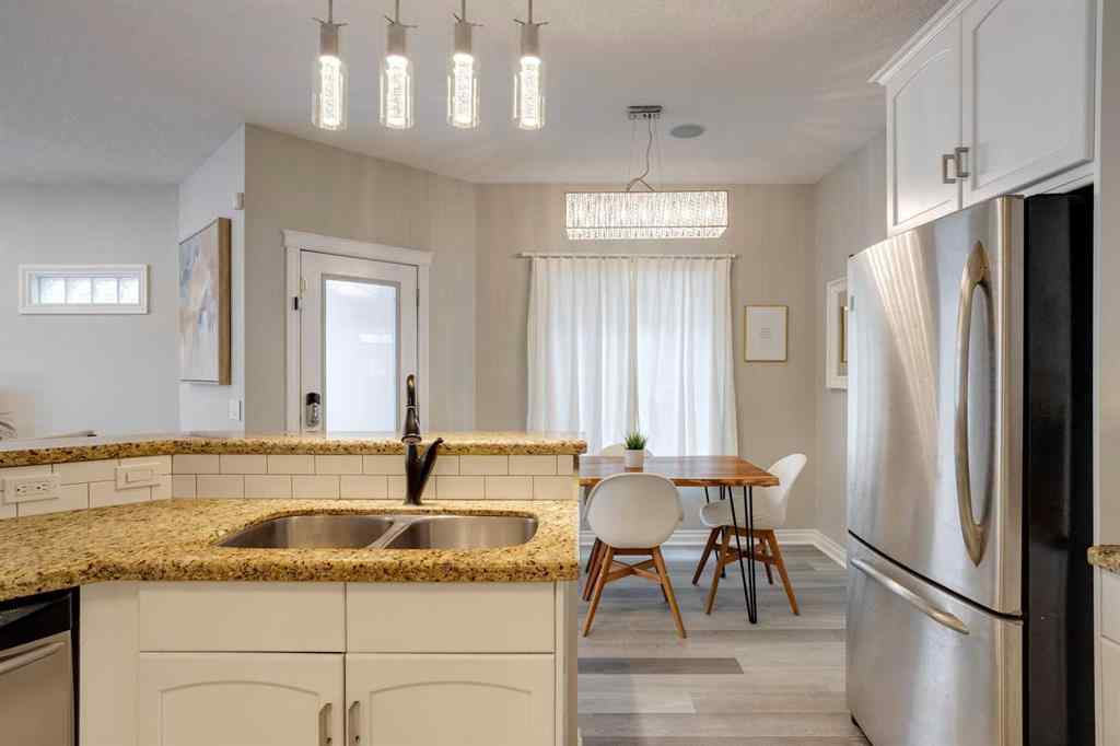 MLS&reg; # A2270592 - Unit #1 219 17 Avenue NE in Tuxedo Park Calgary, Residential Open Houses