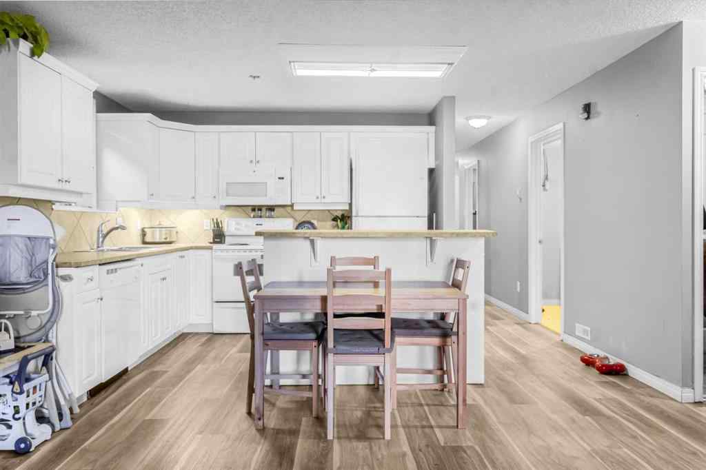 MLS&reg; # A2270701 - Unit #102 139 26 Avenue NW in Tuxedo Park Calgary, Residential Open Houses