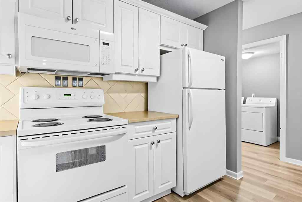 MLS&reg; # A2270701 - Unit #102 139 26 Avenue NW in Tuxedo Park Calgary, Residential Open Houses