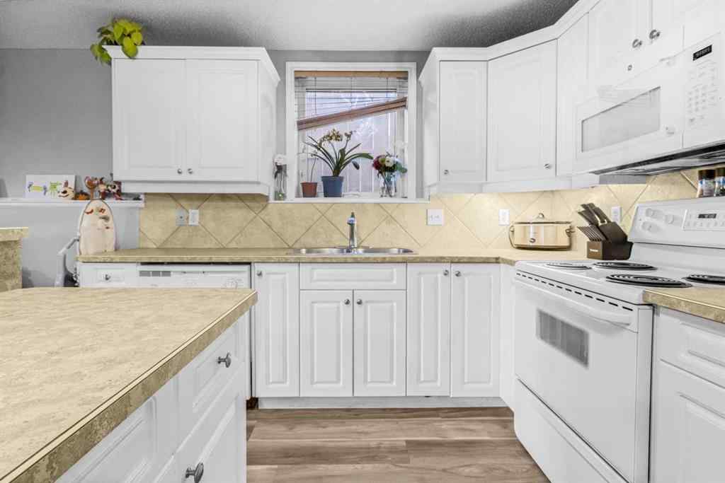 MLS&reg; # A2270701 - Unit #102 139 26 Avenue NW in Tuxedo Park Calgary, Residential Open Houses