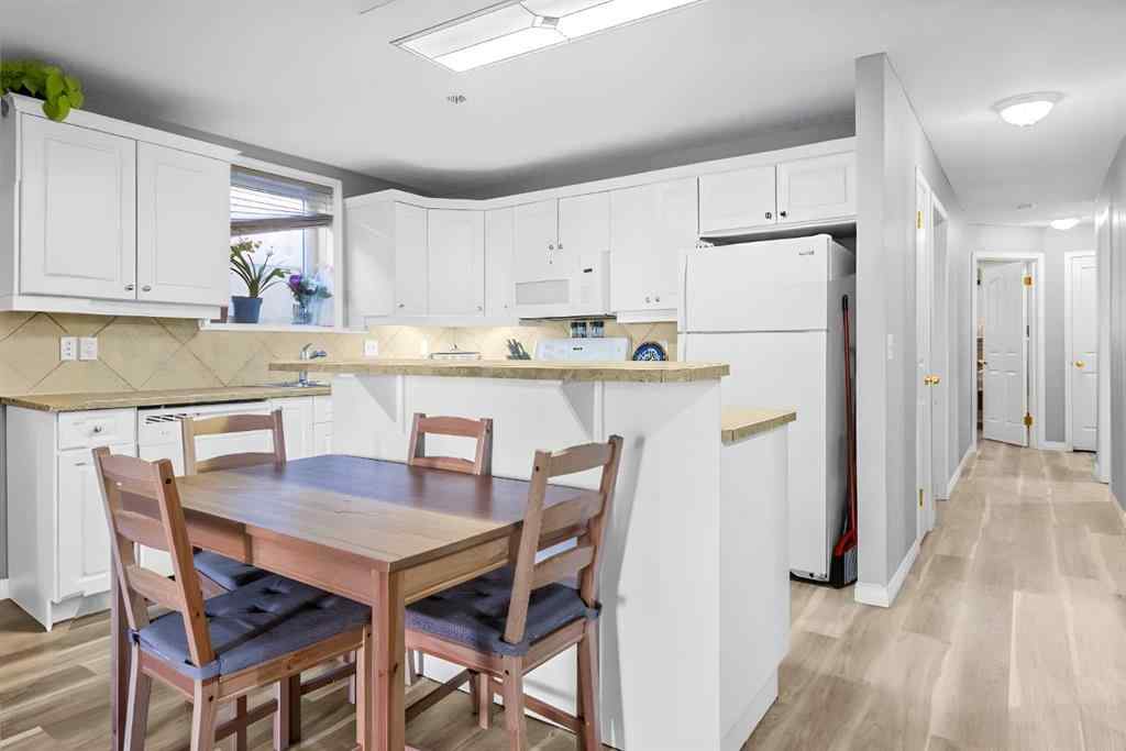 MLS&reg; # A2270701 - Unit #102 139 26 Avenue NW in Tuxedo Park Calgary, Residential Open Houses