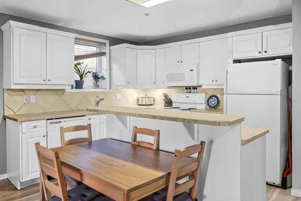 MLS&reg; # A2270701 - Unit #102 139 26 Avenue NW in Tuxedo Park Calgary, Residential Open Houses