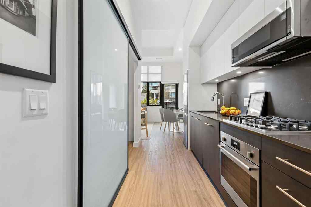 MLS&reg; # A2270737 - Unit #103 730 2 Avenue SW in Eau Claire Calgary, Residential Open Houses