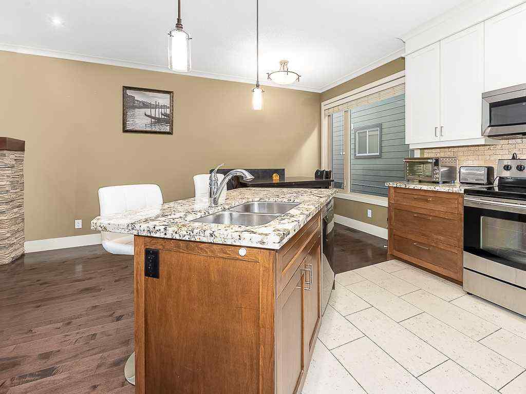 MLS® # A2270967 - Unit #2 126 27 Avenue NW in Tuxedo Park Calgary, Residential Open Houses