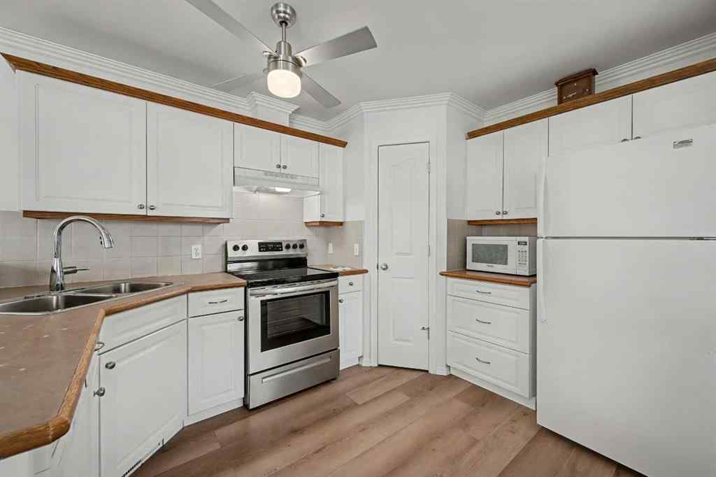 MLS&reg; # A2271045 - 1409 Strathcona Way  in Strathaven Strathmore, Residential Open Houses